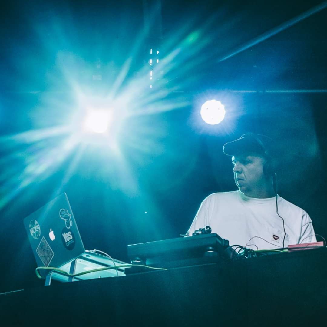 Rhys at the decks under blue stage lights